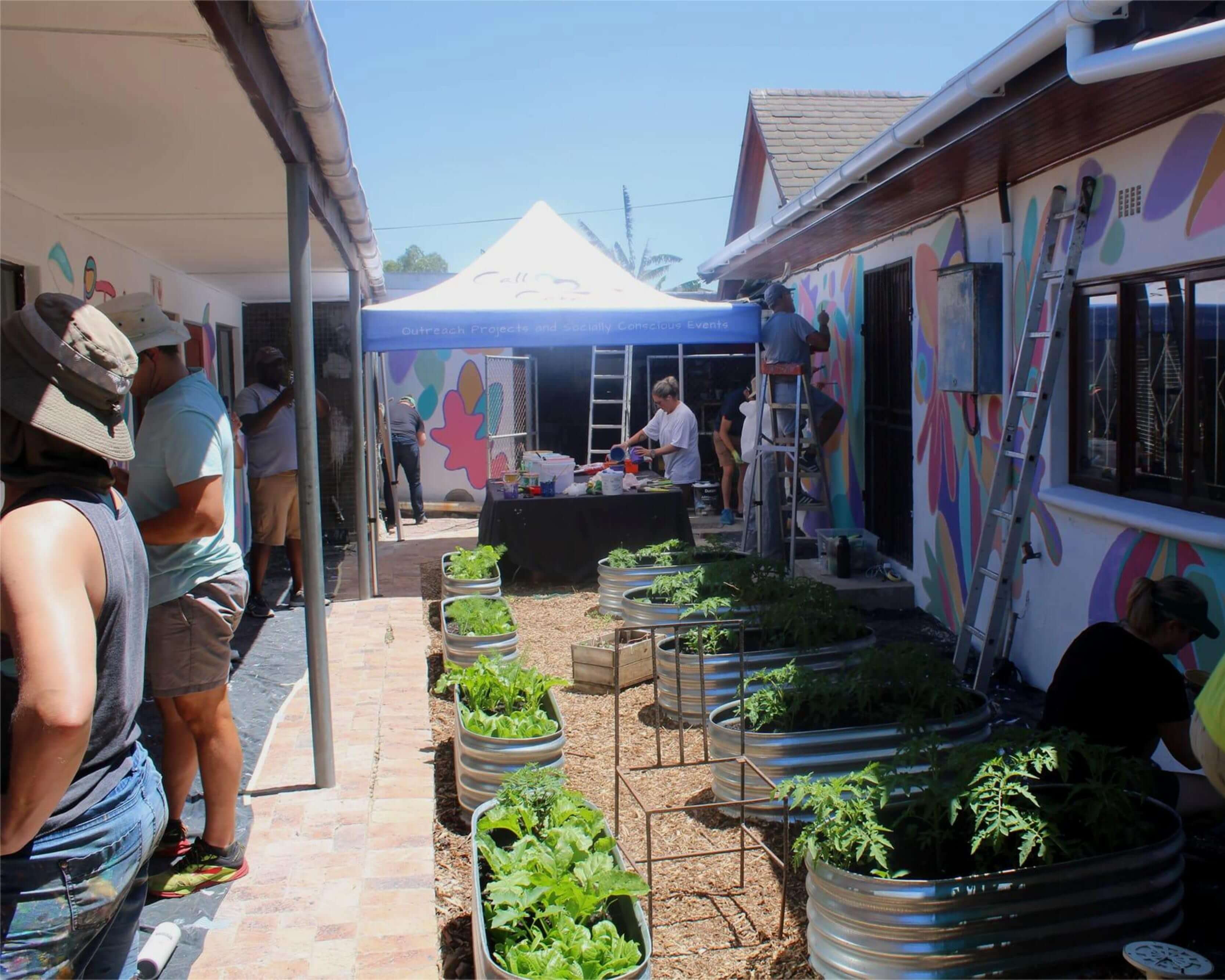 A group of people painting walls